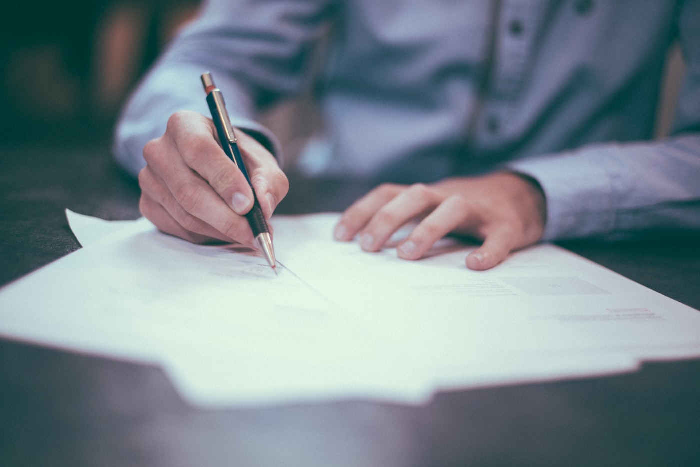 Customs documentation being reviewed and signed for international shipping