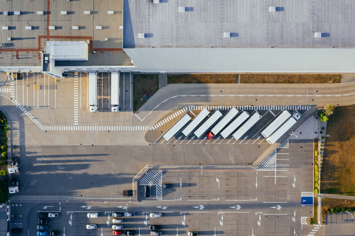 Commercial warehouse and distribution centre with cargo trucks