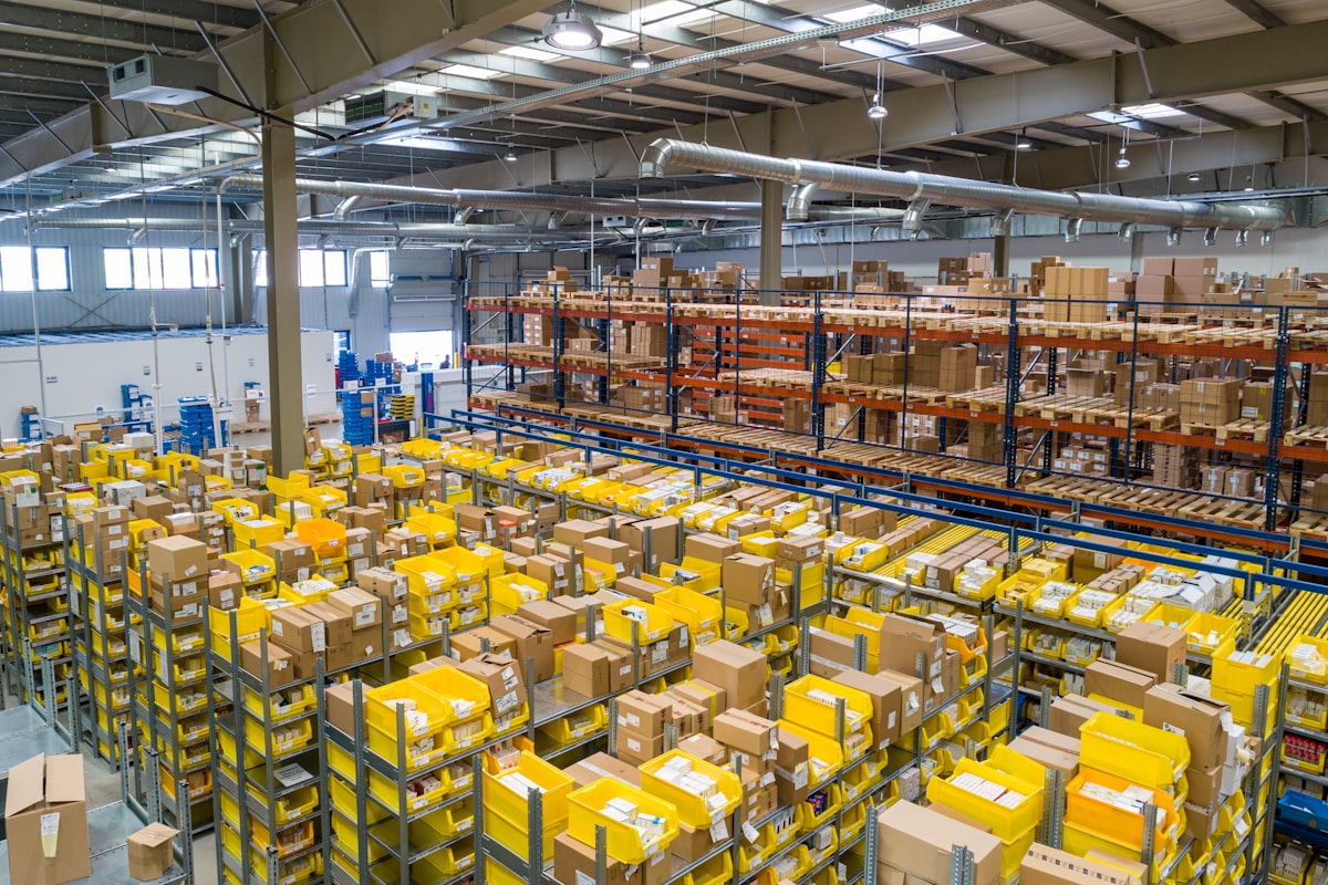 Modern storage warehouse with racks and pallet storage