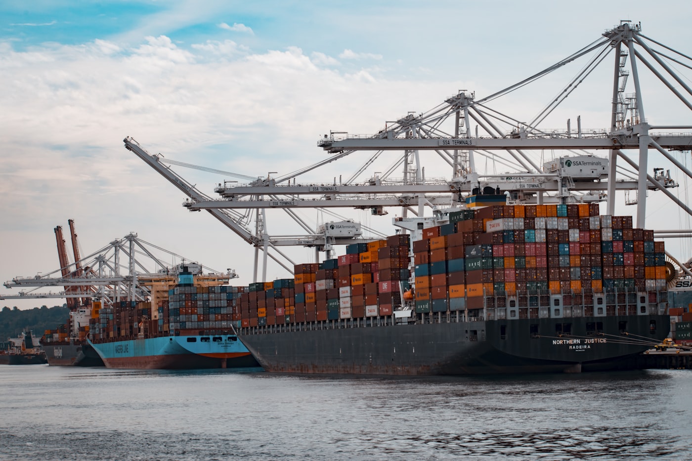Vehicles and containers being loaded at an international export terminal